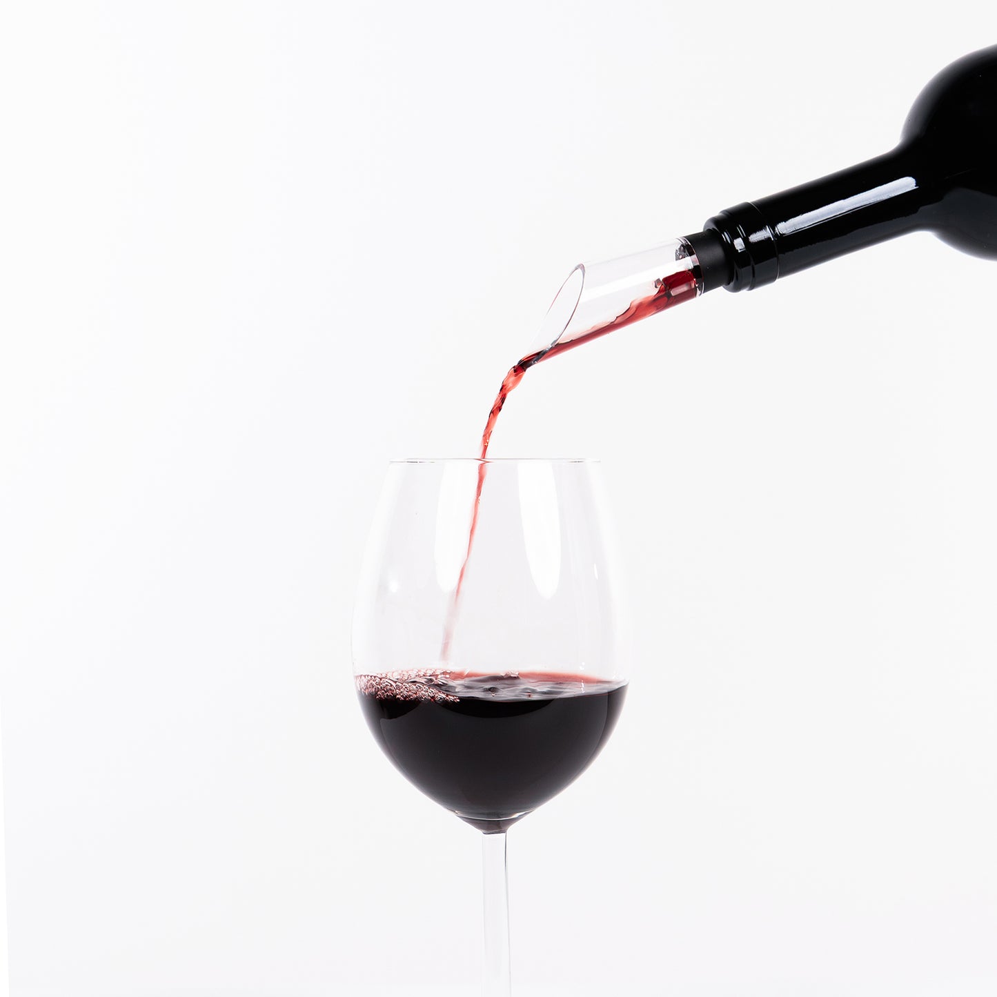 VineKey wine pourer accessory in use — pouring wine into a glass cleanly and smoothly